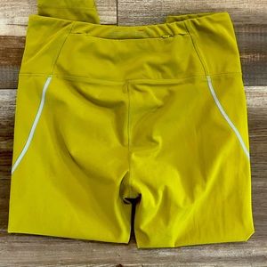 SPYDER brand high waisted, mid calf, reflective back zip pocket active pants.